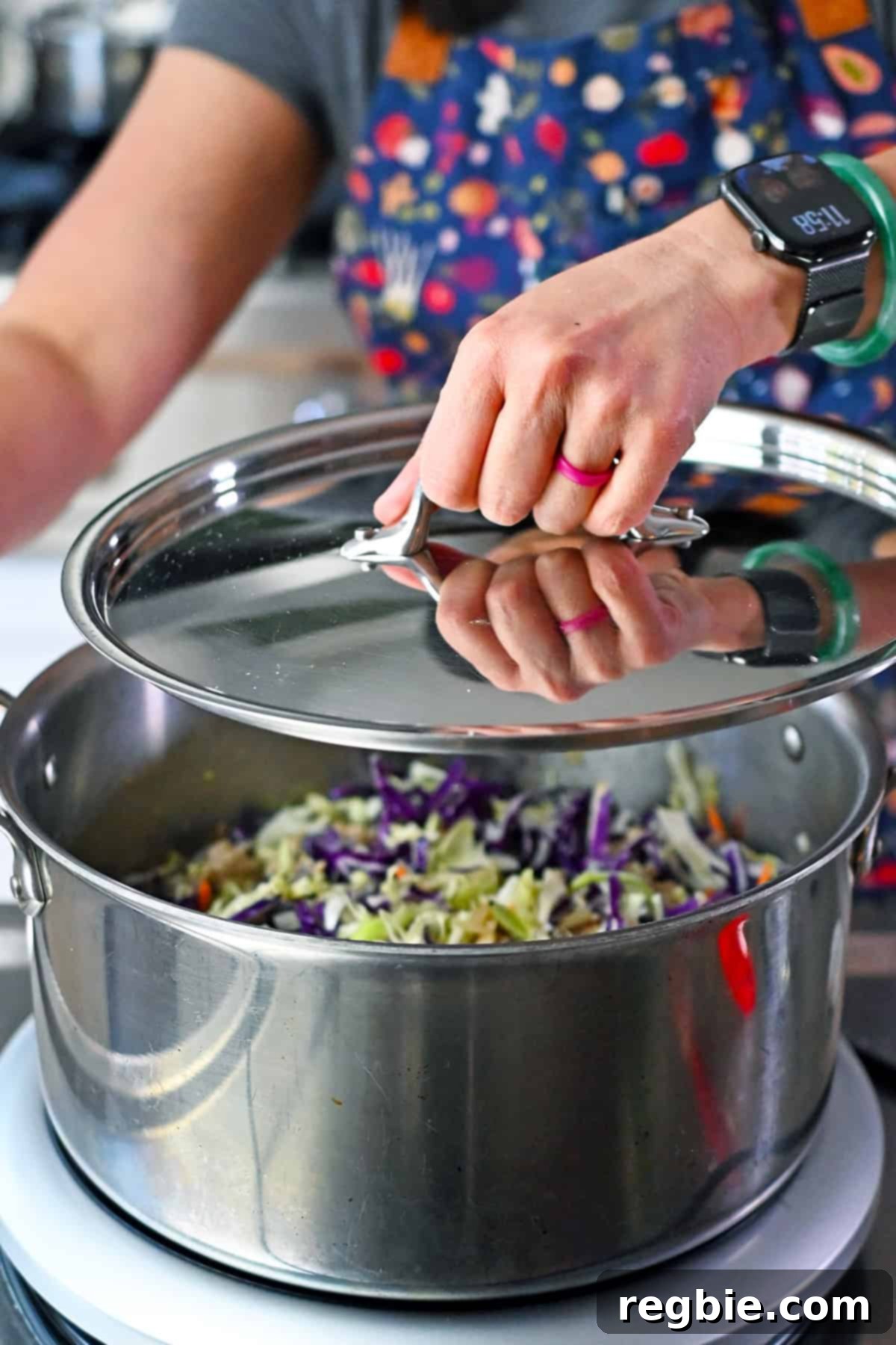 Adding a lid to a pot of chicken and cabbage soup so the soup can come to a boil.