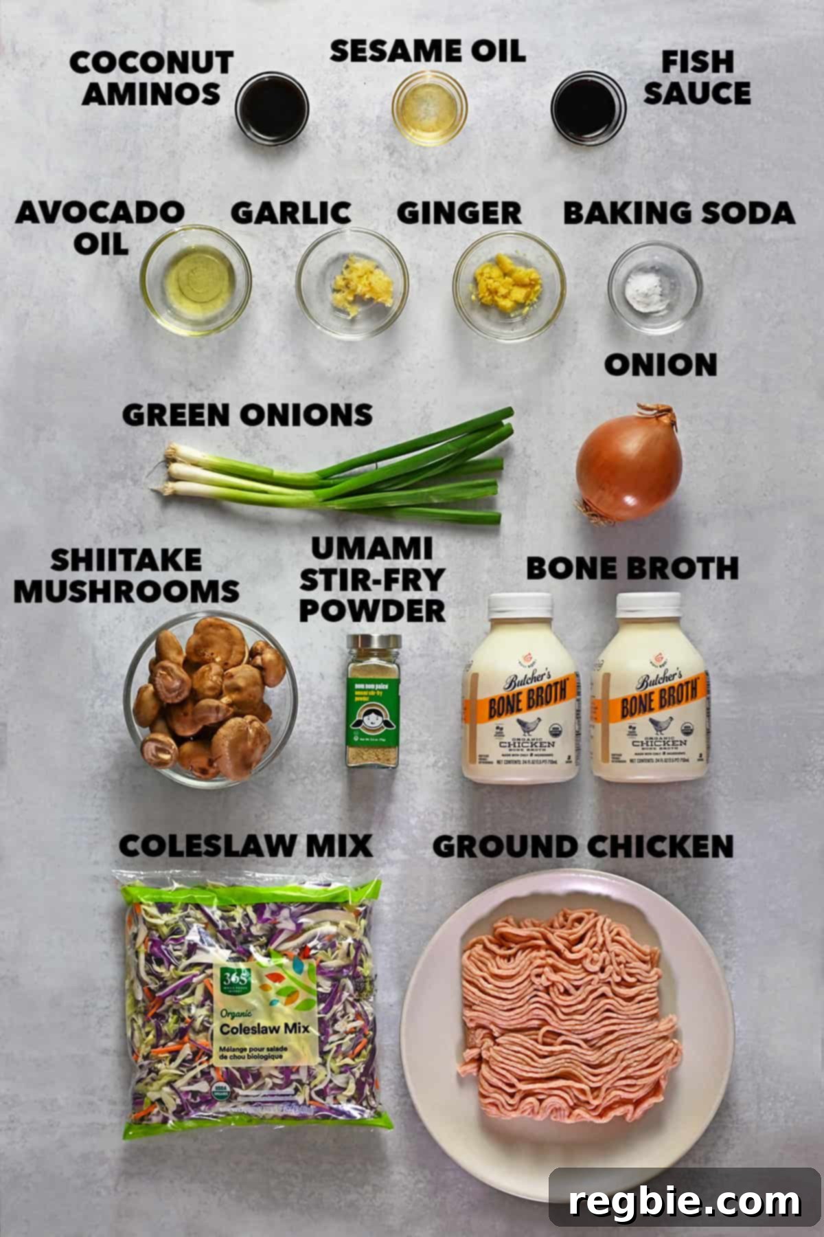 An overhead shot of the raw ingredients to make this Asian-inspired chicken and cabbage soup, neatly arranged.