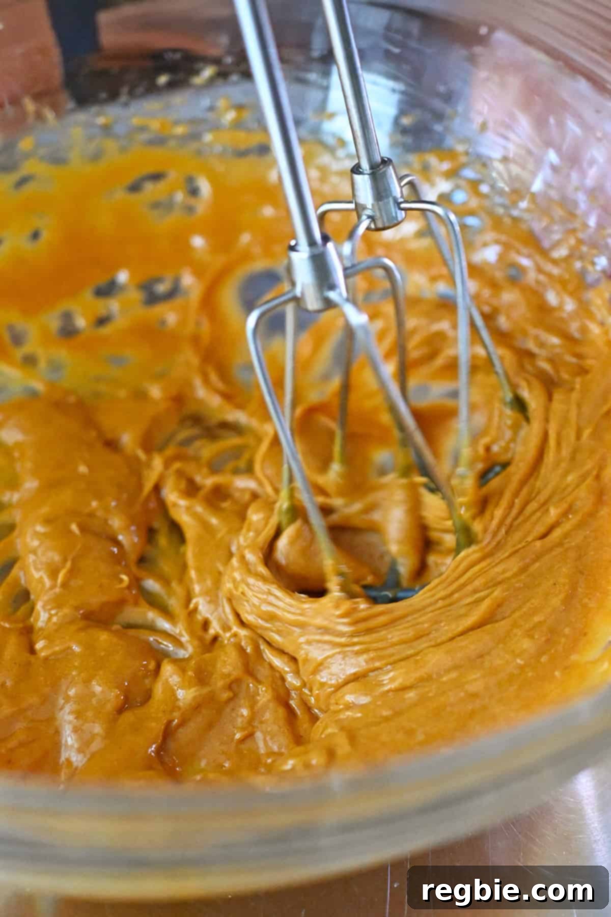 The paleo and gluten free pumpkin snickerdoodle batter is lighter in color after two minutes of mixing.