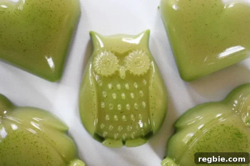 Paleo matcha coconut gummies in various cute shapes, some showing a slightly two-toned effect.