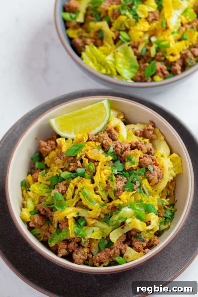 One Pan Beef Cabbage Wonder 15 Two neatly arranged bowls of 'garbage stir fry,' showcasing a delicious and healthy ground beef and curried cabbage dinner, perfectly portioned for meal prep or enjoying leftovers.