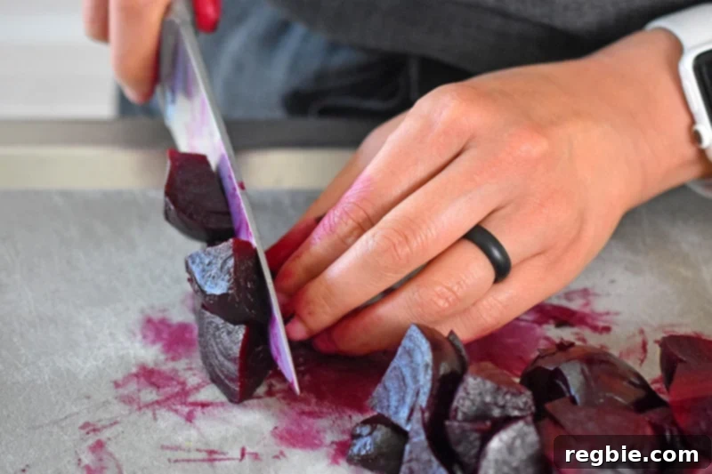 Perfect Instant Pot Beets 13 Someone cutting instant pot cooked beets.