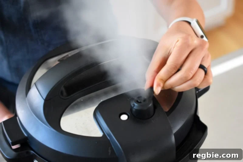 Perfect Instant Pot Beets 9 Someone manually releasing the pressure on an instant pot.
