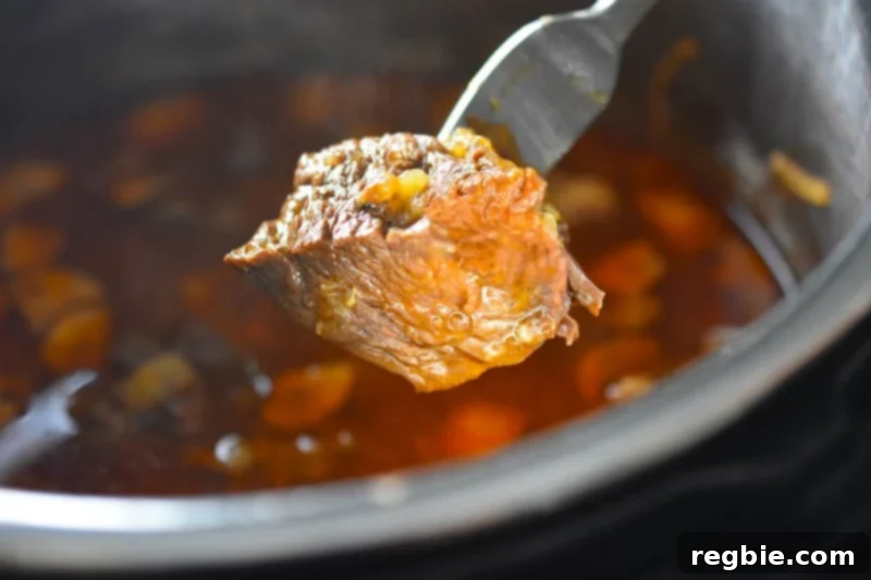 Checking that Instant Pot Beef Stew is fork tender