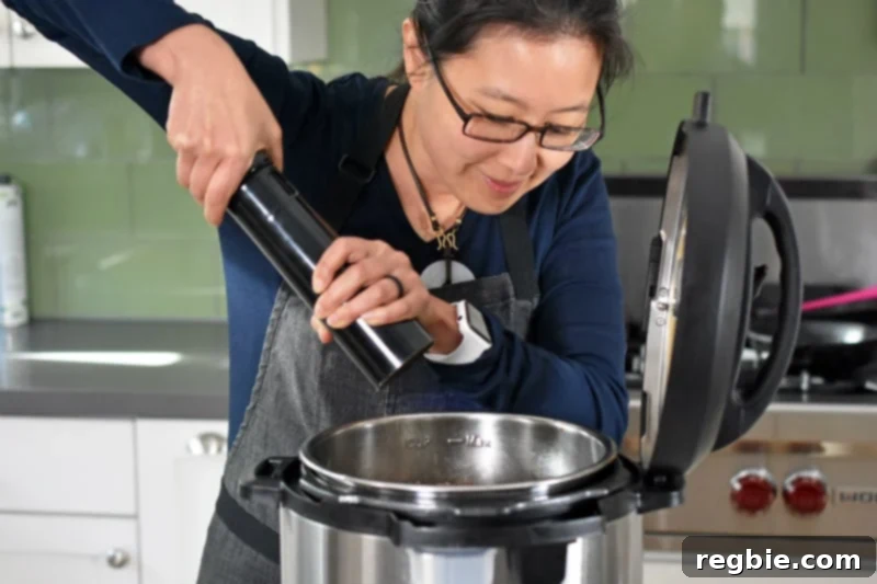 Adding freshly cracked black pepper to Instant Pot Beef Stew 