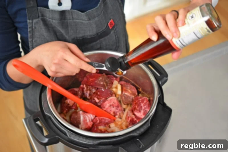Measuring out Red Boat fish sauce for Instant Pot Beef Stew 