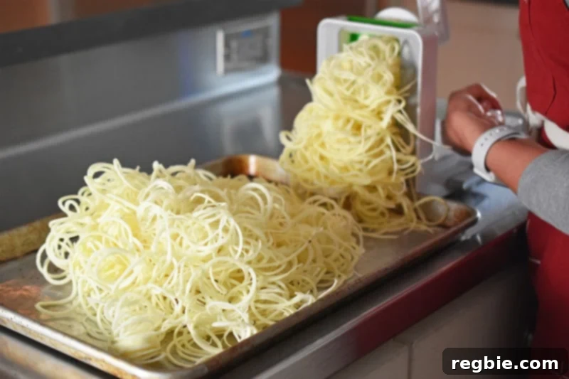 Spiralized white sweet potatoes for Crispy Swoodles with Bacon.