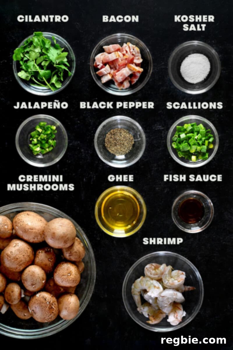 An overhead shot showcasing all the fresh, raw ingredients meticulously laid out to prepare the paleo and keto-friendly shrimp stuffed mushrooms.
