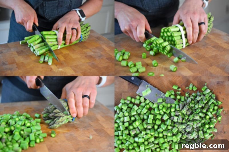 Trimming the ends of asparagus and cutting the stalks into thin coins for Spicy Pork and Asparagus Stir-Fry