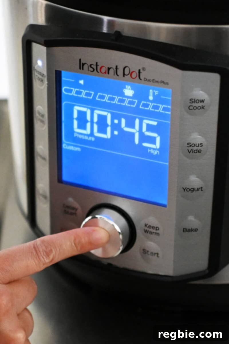 An Instant Pot display that shows it is programmed to cook for 45 minutes under high pressure.