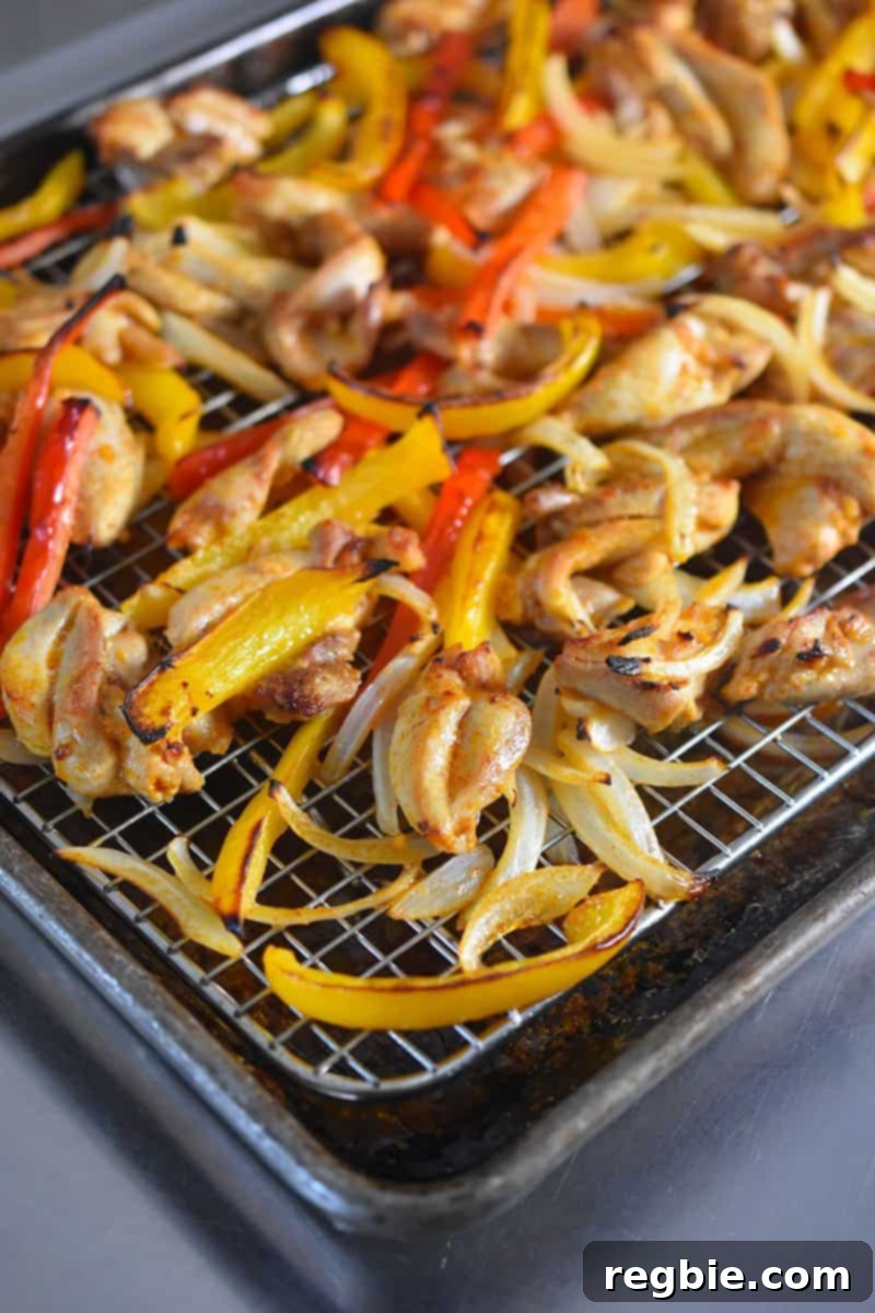 Sheet Pan Chicken Fajitas fresh from the oven, perfectly cooked with browned edges and vibrant colors.