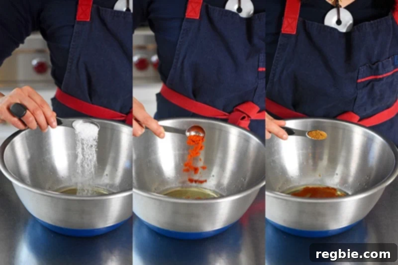 Adding kosher salt, chili powder, and ground cumin to the Sheet Pan Chicken Fajitas marinade for rich flavor.