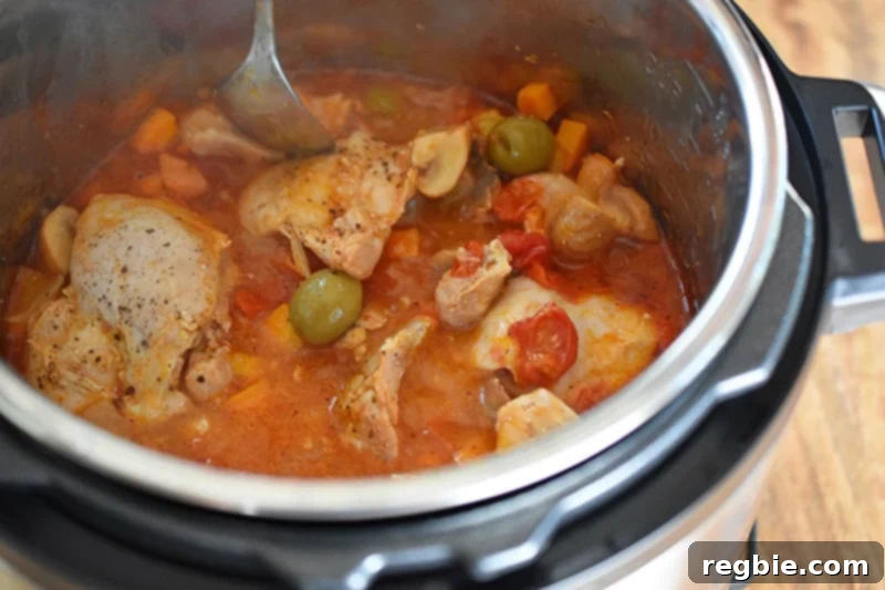 An open Instant Pot filled with delicious Whole30 Summer Italian Chicken stew, ready to serve.