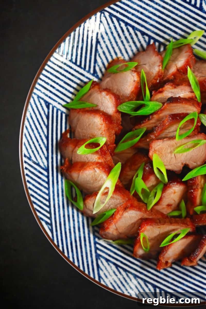 An overhead shot of Whole30-friendly Paleo Char Siu: Cantonese roasted pork lacquered with a sticky-sweet marinade, ready to serve.