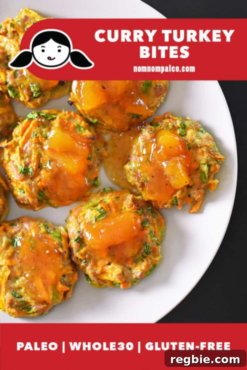 An overhead shot of golden-brown Curry Turkey Bites with a side of glossy Apricot Ginger Sauce on a white plate, garnished with fresh herbs. A red banner clearly indicates the dish is paleo, Whole30, and gluten-free.