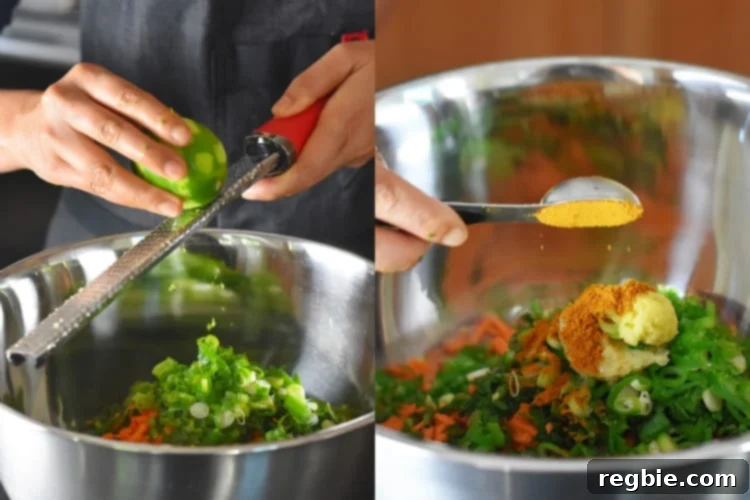 A hand sprinkles vibrant lime zest and rich curry powder into a mixing bowl already filled with raw ingredients, enhancing the flavor profile of the Whole30 Curry Turkey Bites.