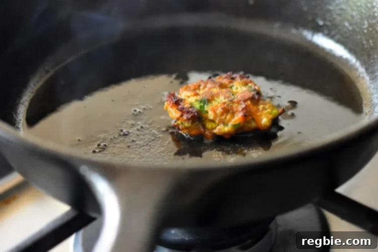 Frying a small tester Curry Turkey Bites in a cast iron skillet to taste for seasoning.