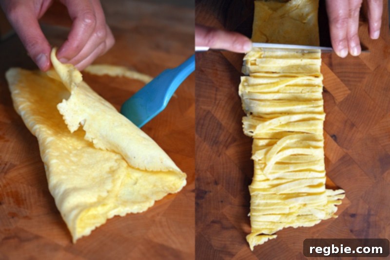 Folding the thinly cooked egg omelet and precisely slicing it into thin, elegant pieces.