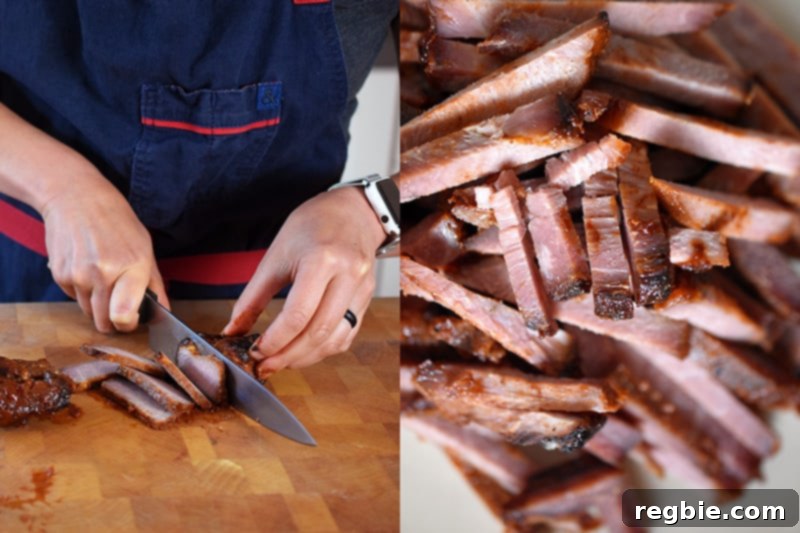 Someone expertly slicing paleo char siu into thin strips, ready for the cold ramen salad.