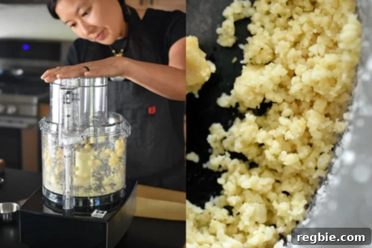 A food processor bowl expertly pulsing a batch of toasted macadamia nuts, transforming them into a textured, coarse sand-like consistency, perfectly suited for the energy ball dough.