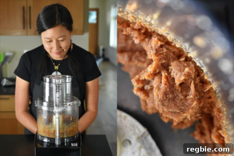 Medjool dates undergoing processing in a food processor, steadily transforming into a smooth, sticky paste, which serves as the crucial binding element for these paleo energy balls.