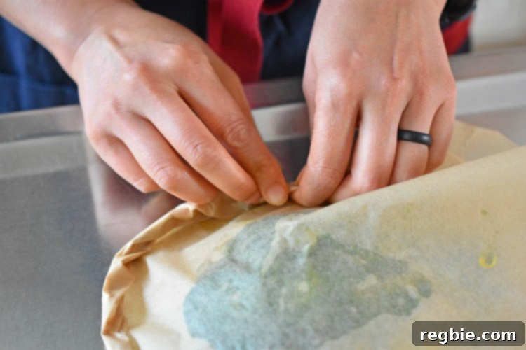 Detail shot of crimping the edges of Fiona’s Phenomenal Fish Packets to create a tight seal.