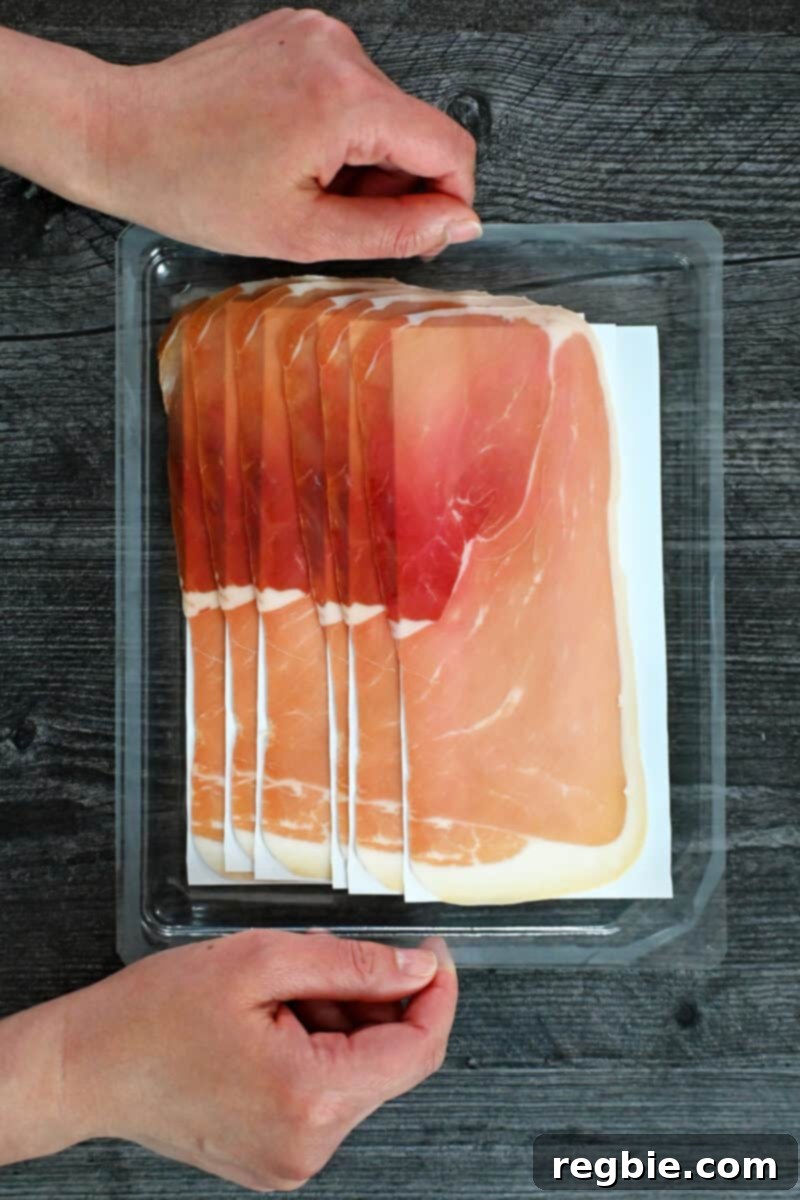 Golden Prosciutto Snaps 4 An overhead shot of an open tray of a package of pre-sliced prosciutto di Parma