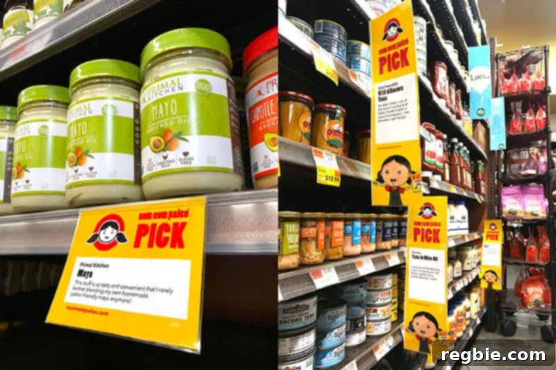 Two Nom Nom Paleo cartoon characters happily shopping in a Whole Foods Market aisle filled with yellow Nom Nom Paleo Picks signs.