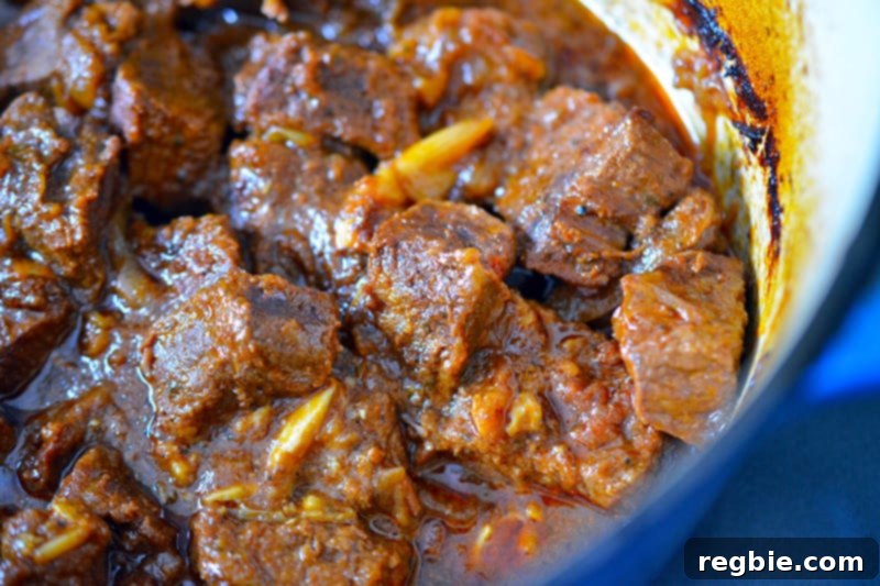 Slow-Roasted Mexican Pulled Beef 7 An overhead shot of perfectly cooked, fork-tender Oven-Braised Mexican Beef resting in the Dutch oven.
