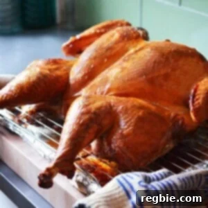 A stunning shot of a Butterflied Big Bird (Spatchcocked Turkey) with golden crispy skin, ready to be carved and served, promising a tender and juicy culinary experience.