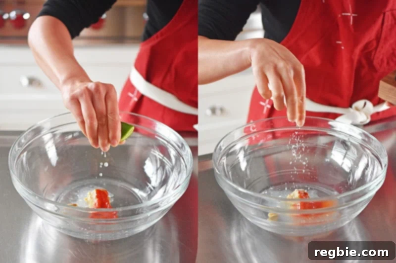 Someone squeezing fresh lime juice and adding a pinch of salt to a bowl, preparing the spicy Thai dressing base with sunflower seed butter and sriracha.