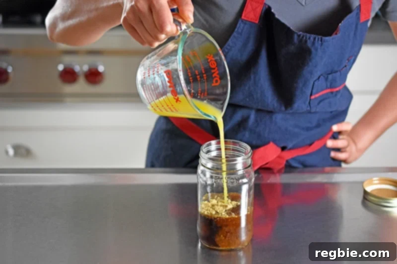 Adding fresh orange juice to the jar, complementing the other ingredients for a balanced All-Purpose Stir-Fry Sauce.