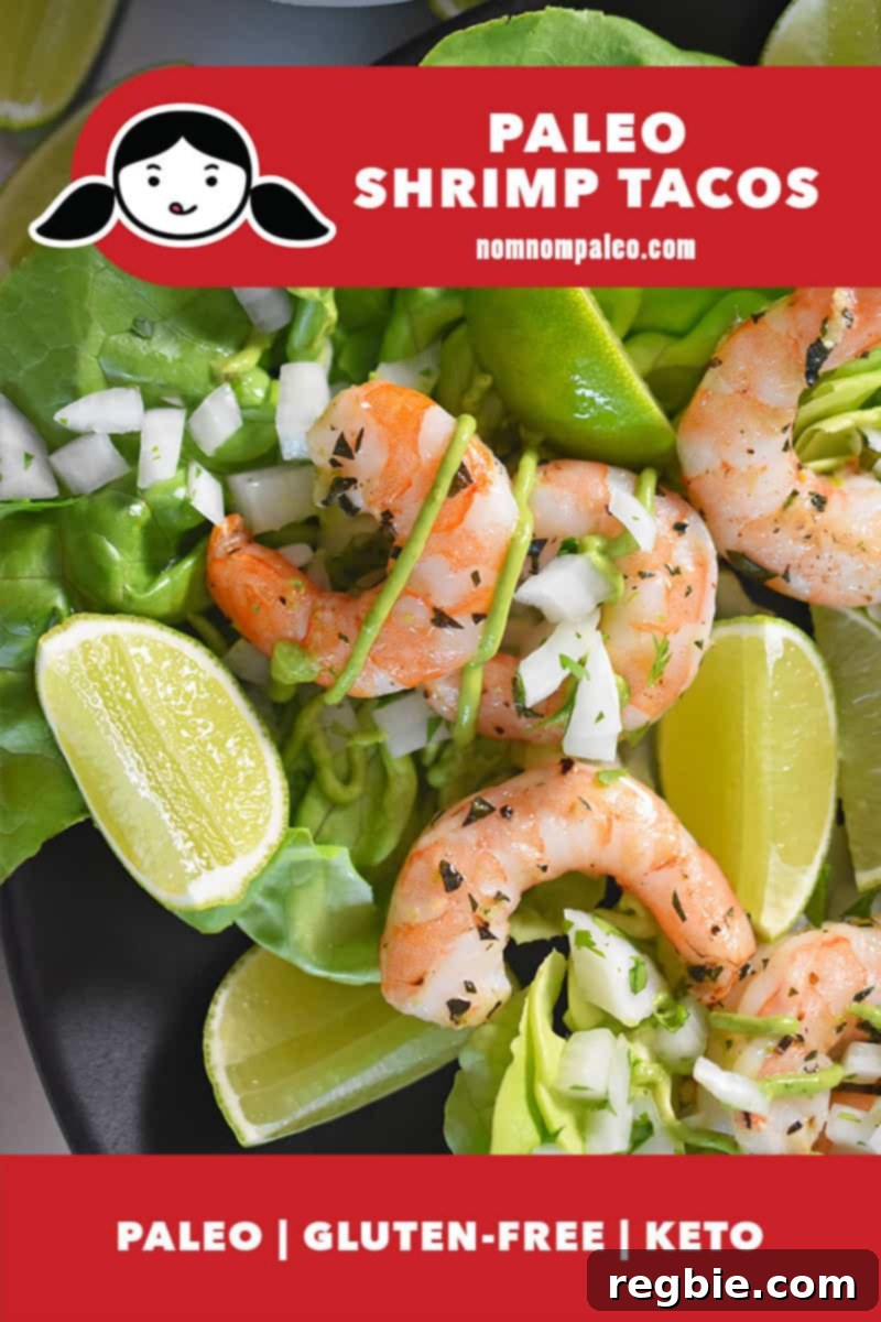 A closeup of vibrant Paleo Shrimp Tacos arranged on a bed of fresh butter lettuce, generously topped with a rich, green Avocado Crema. A label indicates they are paleo, gluten-free, and keto-friendly.
