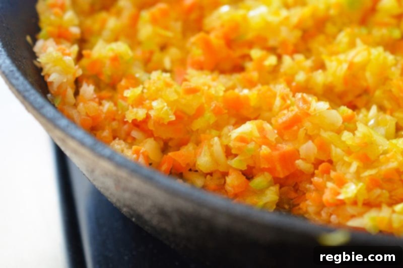 Homemade soffritto, a flavorful base for countless Paleo dishes, made with carrots, celery, and onions.