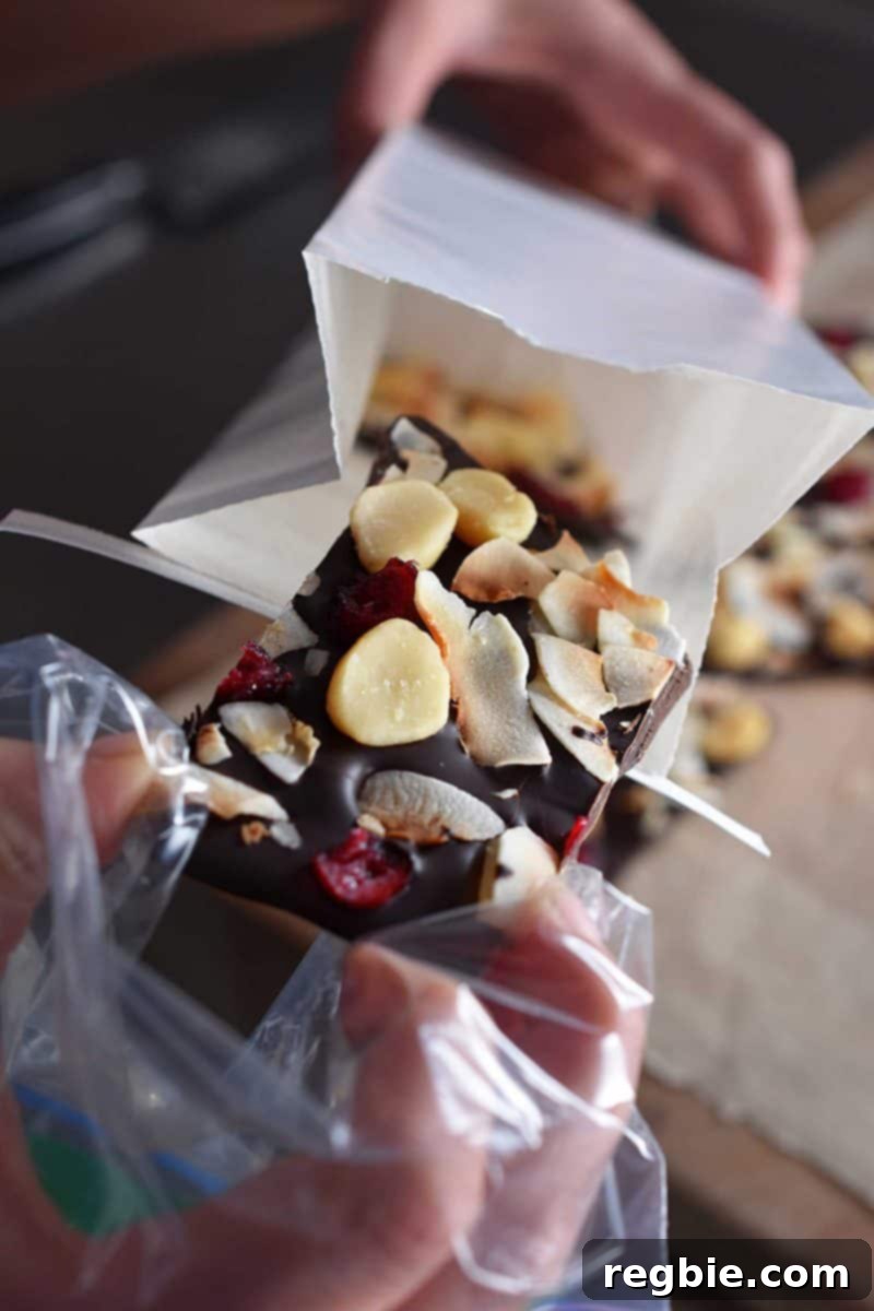 Coco-Nutty Dark Bark by Michelle Tam / Nom Nom Paleo https://nomnompaleo.com showing how to handle chocolate bark without leaving fingerprints.