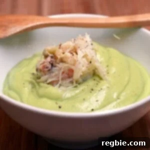 Bowl of chilled cream of avocado soup with dungeness crab