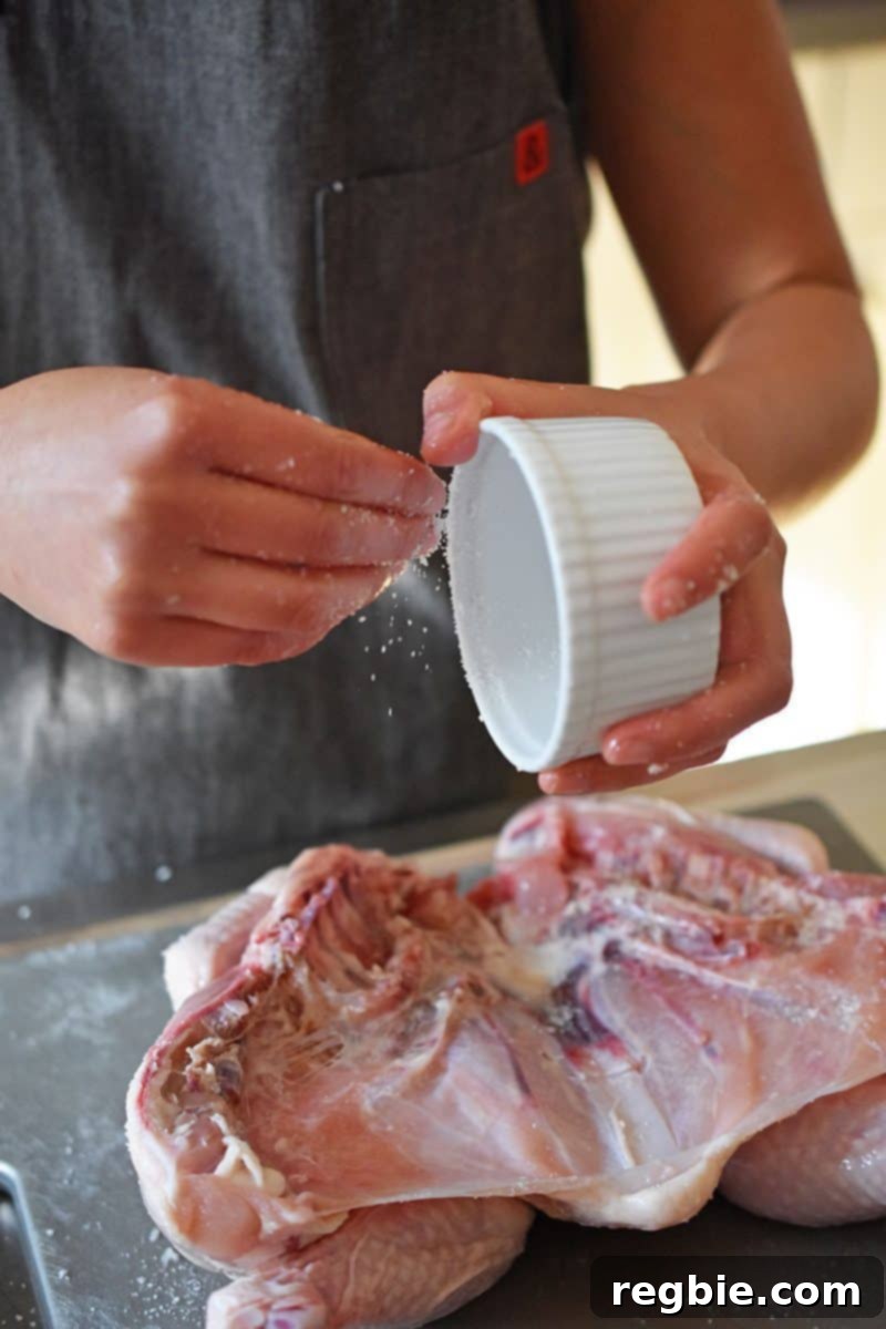 Transform Chicken with Herb Butter Spatchcock Juicy and Crispy 12 Sprinkling salt on the back of the Spatchcocked Chicken to complete the dry brining process.