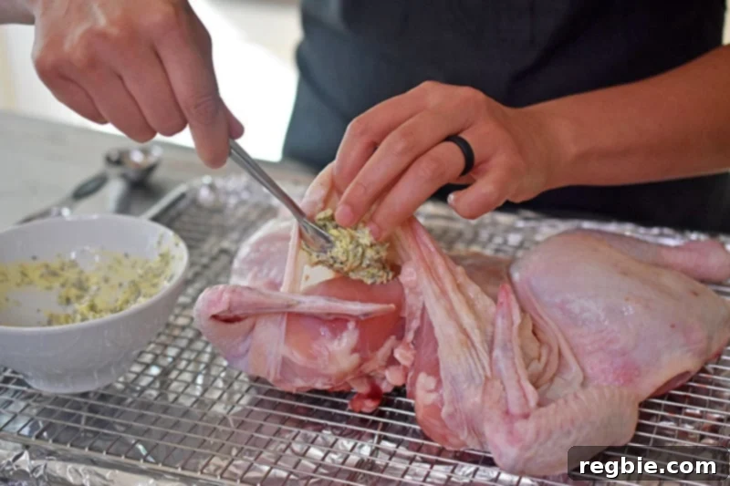 Transform Chicken with Herb Butter Spatchcock Juicy and Crispy 16 Tucking the softened herb butter underneath the skin of the spatchcocked chicken breast.