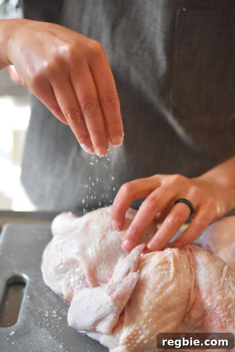 Transform Chicken with Herb Butter Spatchcock Juicy and Crispy 10 Sprinkling kosher salt on top of the raw chicken skin for dry brining.