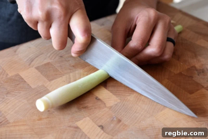 Lemongrass Cooking Guide 6 Cutting a trimmed lemongrass stalk so that it is the tender part near the base, about 3-4 inches from the root end.