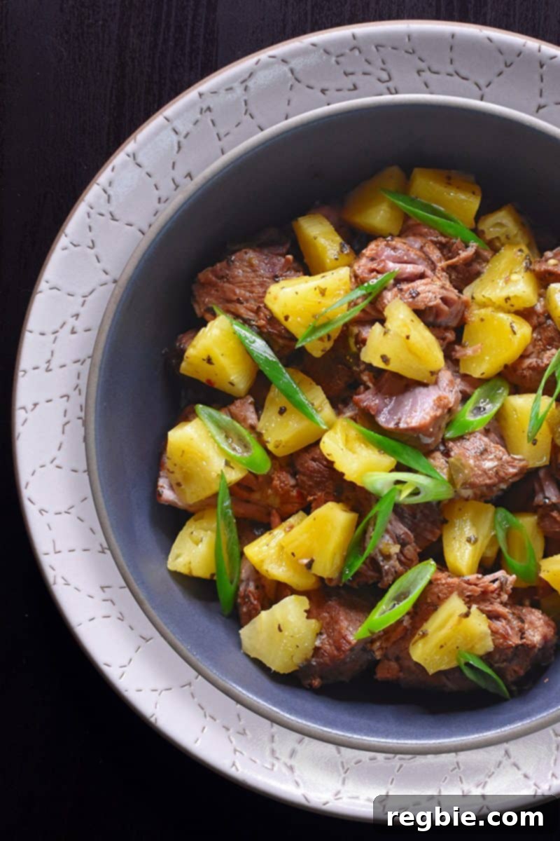 An overhead shot of Instant Pot Pineapple Pork topped with sliced scallions.