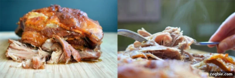 Two forks actively shredding the perfectly cooked Slow Cooker Kalua Pig into tender pieces on a cutting board.
