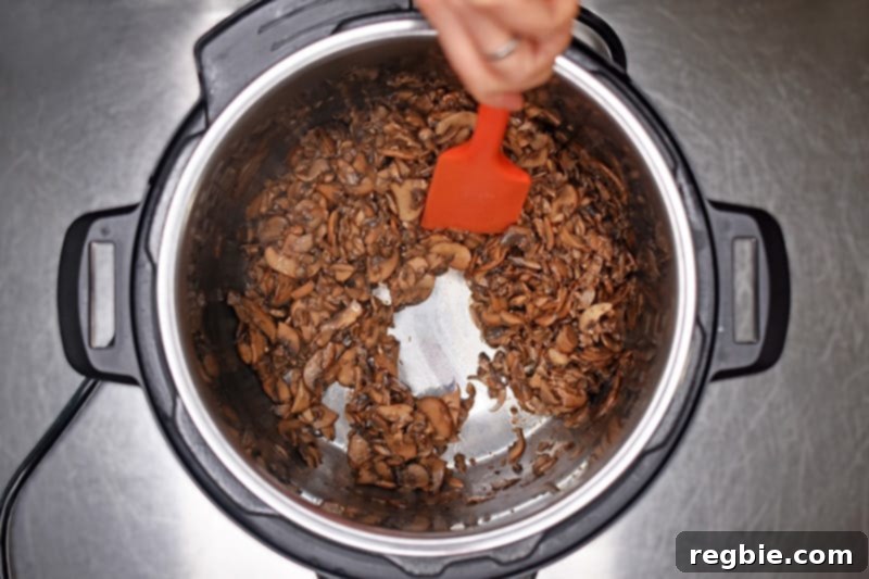 An overhead shot of sautéed mushrooms in an Instant Pot.
