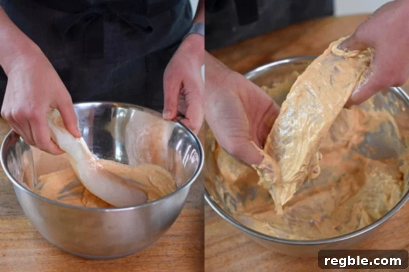 Cod fillets are gently dipped in the Tandoori Fish marinade, ensuring full coverage.