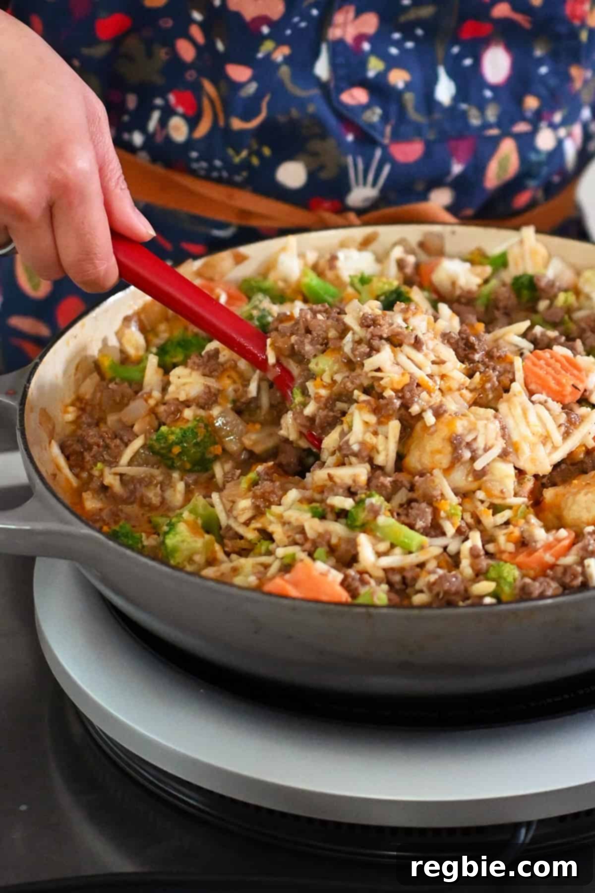 One-Pan Ground Beef and Veggie Power Bowl 14 Mixing vegetables and sauce